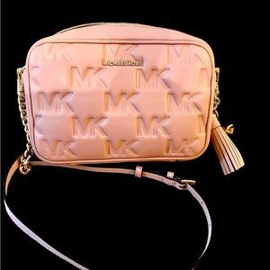 A Michael Kors jet set crossbody  smokey Rose